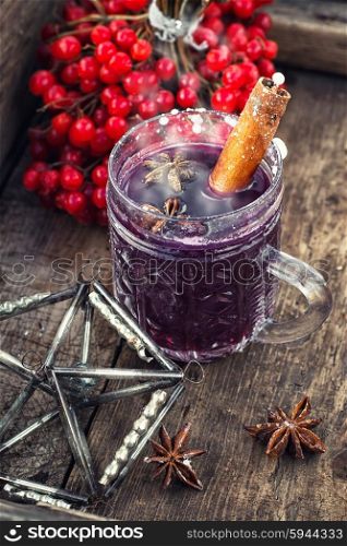 glass of wine with the cinnamon stick