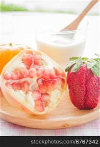 Glass of yogurt with fresh mix fruit , stock photo