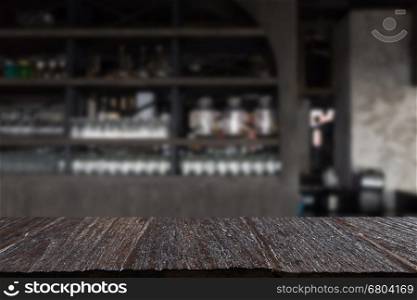 glass on counter bar in restaurant interior blur background with selected focus empty wood table for display or montage your product