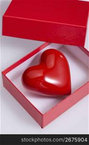 Glass red heart in a red box