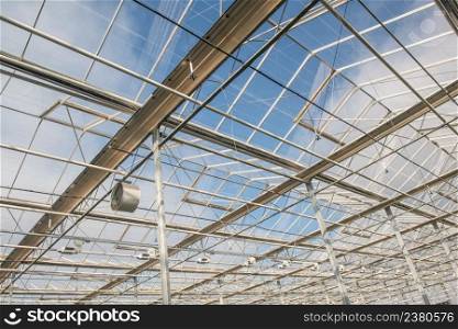 glass roof with fan in modern greenhouse. the roof in the greenhouse