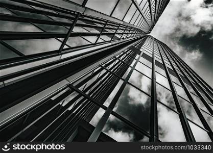 Glass surface of skyscrapers view in district of business centers. black and white