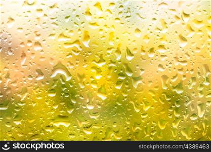 Glass surface with water drops in a rainy day