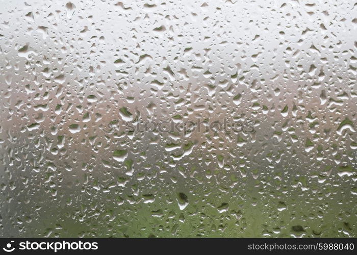 Glass surface with water drops in a rainy day