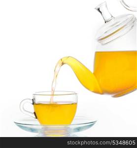 Glass teapot and cup of tea isolated