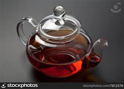 glass teapot with black tea