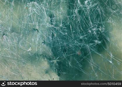 Glass texture. Image of green glass texture close-up with scratches over surface