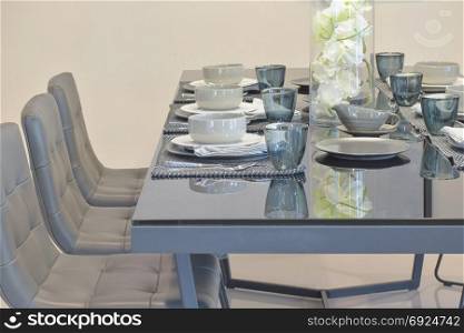 Glass top dining table with modern style dining set in dining room