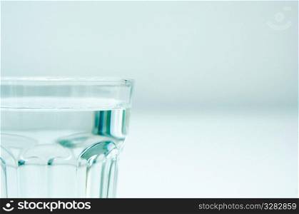 Glass tumbler of clear water.