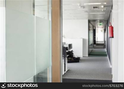 Glass wall and narrow passageway in office