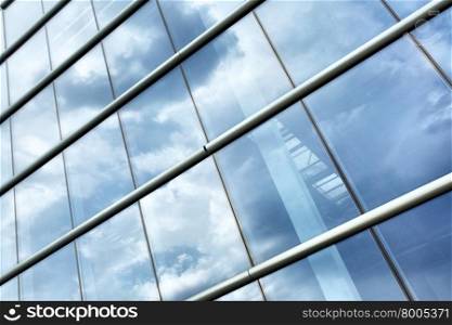 Glass wall modern industrial building and sky reflection&#xA;