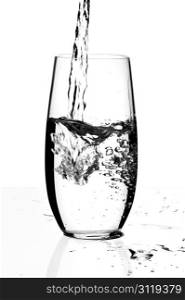 Glass with a water, isolated on a white background.
