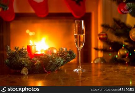 Glass with champagne on Christmas table