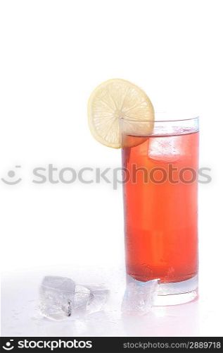 glass with drink and lemon are on surface