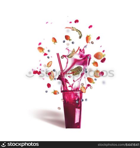 Glass with drinking straw and pink purple splash summer beverage: smoothie or juice with flying berries ingredients, isolated on white background, front view