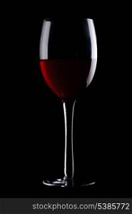 Glass with red wine isolated on black