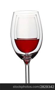 glass with red wine on white