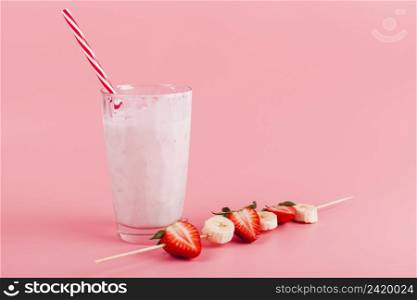 glass yogurt with fruit skewer