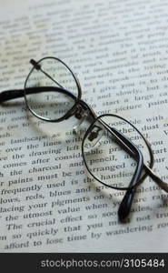 Glasses and book