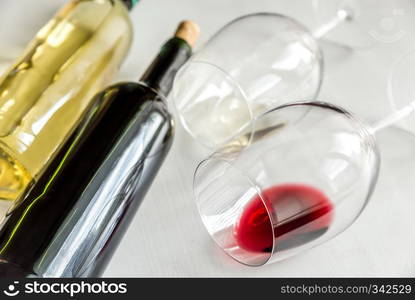 Glasses and bottles with red and white wine