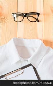 glasses and shirt, business accessories close up