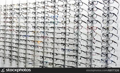 glasses background. glasses displayed. eye glasses on the shelf. eyeglass at an opticians store