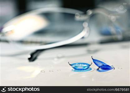 glasses, colored contact lenses, vision concept