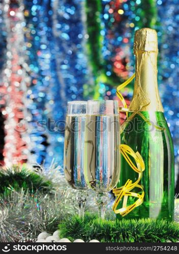 Glasses of a champagne. A christmas drink on the dim color background