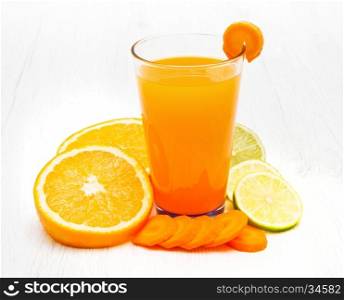 Glasses of ace juice with carrot,orange and lemon