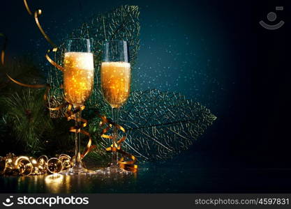 Glasses of champagne at new year party. Two champagne glasses ready to bring in the New Year