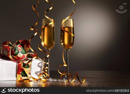 Glasses of champagne at new year party. Two champagne glasses ready to bring in the New Year