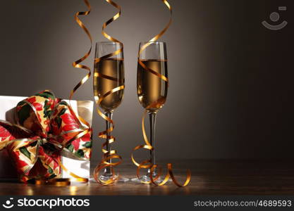 Glasses of champagne at new year party. Two champagne glasses ready to bring in the New Year