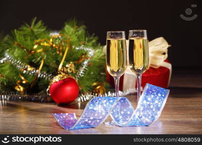 Glasses of champagne at new year party. Two champagne glasses ready to bring in the New Year