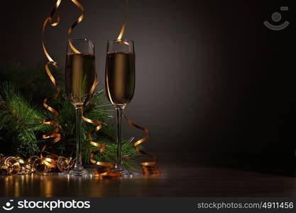 Glasses of champagne at new year party. Two champagne glasses ready to bring in the New Year