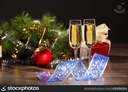 Glasses of champagne at new year party. Two champagne glasses ready to bring in the New Year