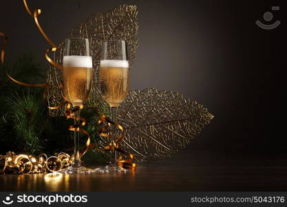 Glasses of champagne at new year party. Two champagne glasses ready to bring in the New Year