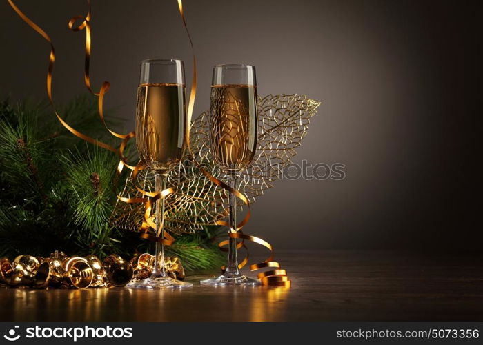 Glasses of champagne at new year party. Two champagne glasses ready to bring in the New Year