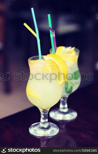 Glasses of cold lemonade with straw