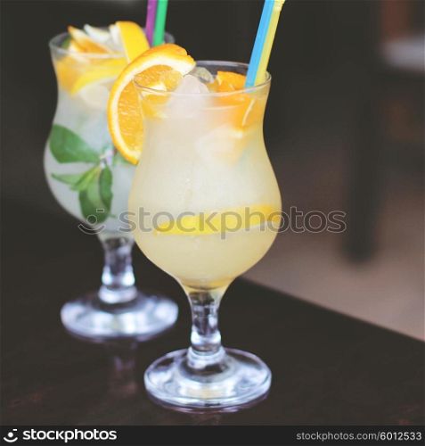 Glasses of cold lemonade with straw