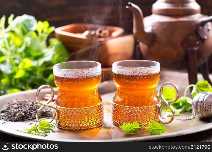 glasses of hot tea with teapot