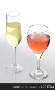 glasses of pink and white wine on white background