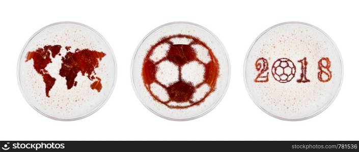 Glasses of red ale beer with world football shape on white background top view