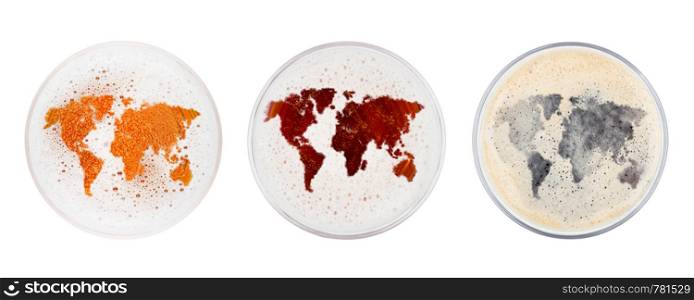 Glasses of red ale stout and lager beer top with earth map shape on white background top view