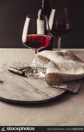 Glasses of red wine on concrete background. Glasses of red wine on concrete background, close up