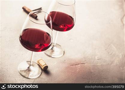 Glasses of red wine on concrete background. Glasses of red wine on concrete background, copyspace