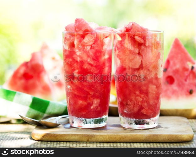 glasses of watermelon granita on wooden table