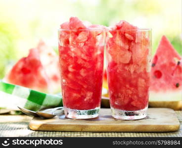 glasses of watermelon granita on wooden table