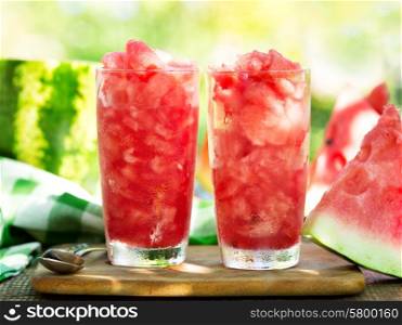 glasses of watermelon granita on wooden table