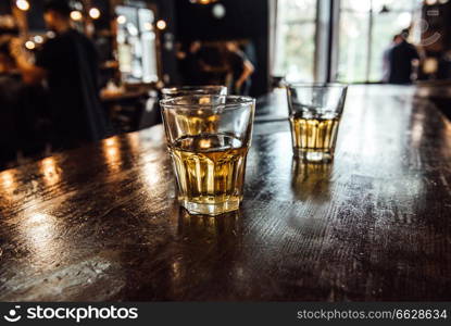 glasses of whiskey on the table in the barbershop