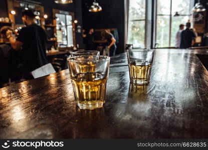 glasses of whiskey on the table in the barbershop